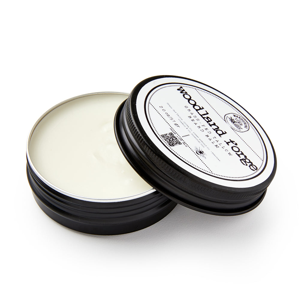 Open container of woodwax finish with 'woodland forge' branding on a white background