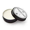 Open container of woodwax finish with 'woodland forge' branding on a white background