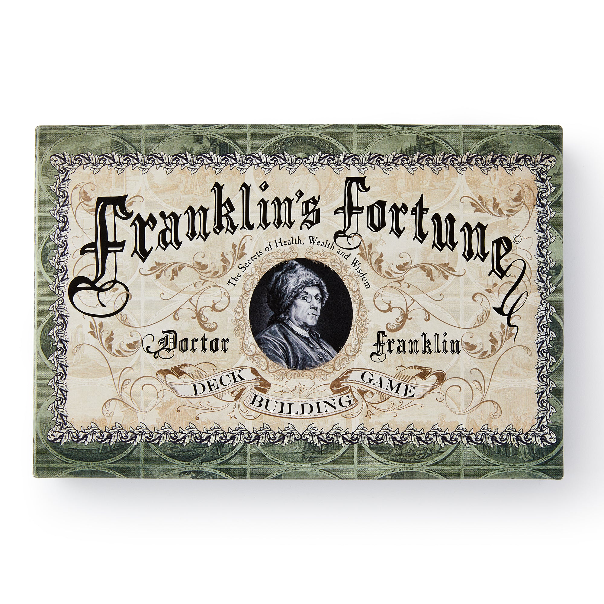 A decorative game box labeled “Franklin’s Fortune Deck Building Game,” adorned with ornate scrollwork and a central portrait of Benjamin Franklin.