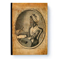 An old, sepia-toned illustration of an African American woman in 18th-century dress sits at a desk with quill and papers, framed in an oval—an homage featured on the Phillis Wheatley Large Journal celebrating her literary legacy.