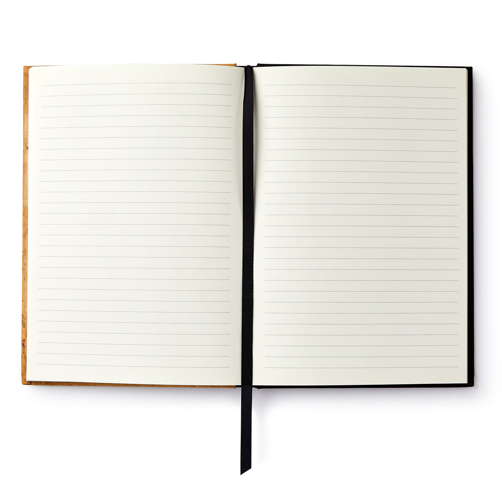 The Phillis Wheatley Large Journal features open lined pages and a black ribbon bookmark, seen from above on a white background—ideal as a keepsake inspired by African American literature.