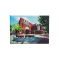The Museum Facade Magnet features the striking brick exterior of the Museum of the American Revolution, complete with cannons at the entrance, set beneath a clear sky and bordered by lush trees.