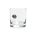 The Musket Ball Rocks Glass, handcrafted in the USA from clear glass and featuring a metallic musket ball-inspired sphere embedded in its side, is displayed against a plain white background.