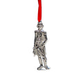 The George Washington Pewter Ornament, crafted in a silver-toned finish and depicting the historic figure in period attire, hangs from a vibrant red ribbon against a white background—making it an ideal decoration for celebrating patriotic holidays.
