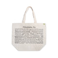 The Philadelphia Pride Ecotote is a beige cotton canvas tote bag featuring “Philadelphia, PA” at the top and black printed names of city landmarks, streets, and Philly trivia phrases arranged in various fonts and sizes. This Philadelphia tote includes two sturdy handles and a small green tag.