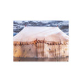 A large beige canvas tent with ropes and stakes sits under a cloudy sky, warmly lit from within—captured beautifully on the George Washington’s War Tent Postcard, evoking the legendary war tent preserved at the Museum of the American Revolution.