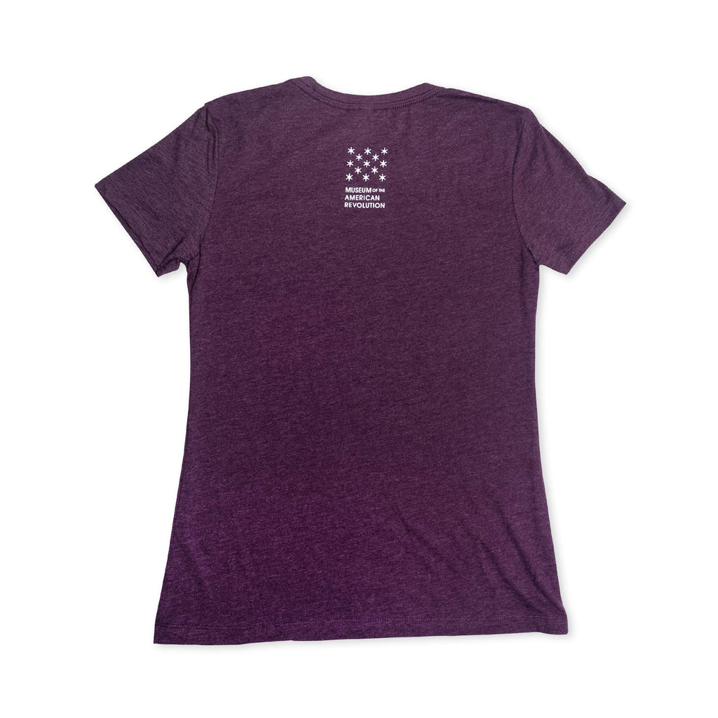 A plum-colored short-sleeve Well-Behaved Women T-Shirt is shown from the back, featuring a small white logo with stars and "Museum of the American Revolution" near the top—perfect for anyone seeking a women's history shirt that celebrates impactful stories.