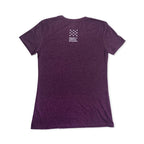 A plum-colored short-sleeve Well-Behaved Women T-Shirt is shown from the back, featuring a small white logo with stars and "Museum of the American Revolution" near the top—perfect for anyone seeking a women's history shirt that celebrates impactful stories.