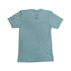 Light blue short-sleeve Remember the Ladies T-Shirt (MoAR) displayed flat with the back facing up. Small black text and a star pattern are printed near the neckline, offering a subtle tribute to women’s rights. The rest of this commemorative Abigail Adams tee remains plain.