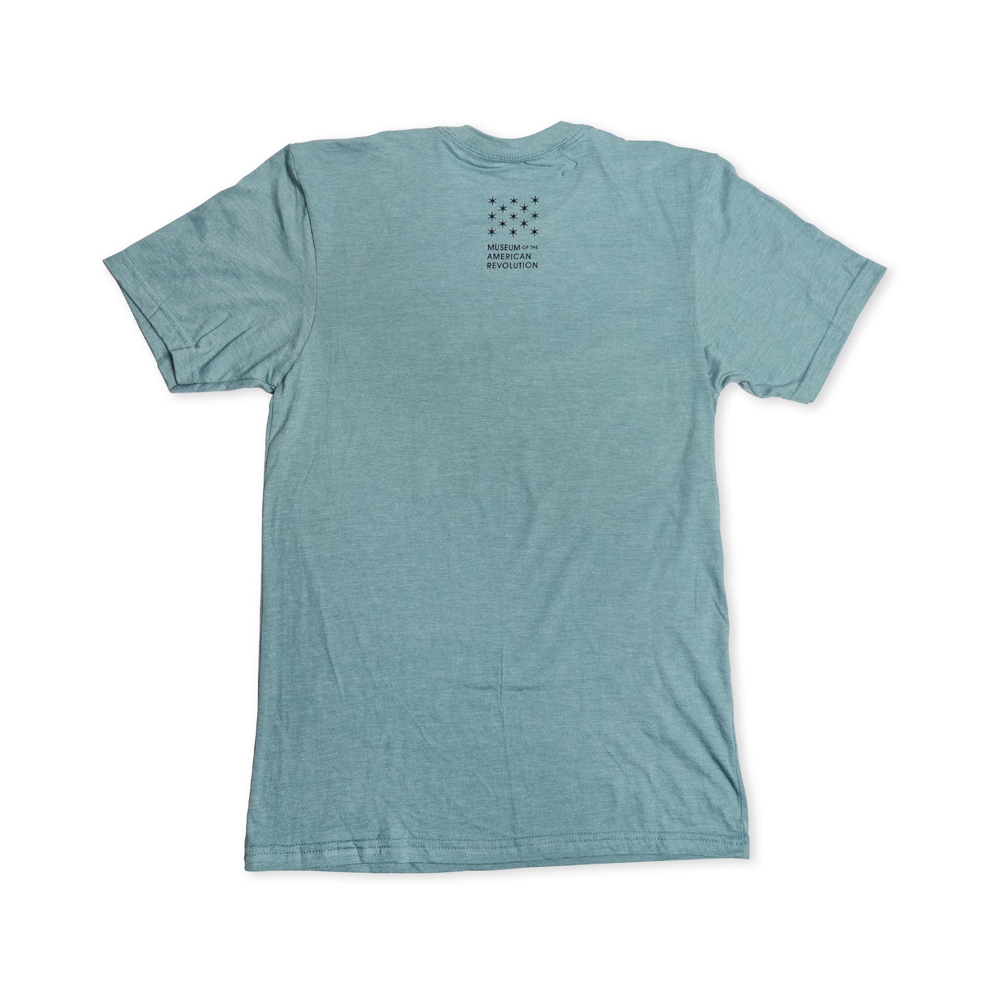 Light blue short-sleeve Remember the Ladies T-Shirt (MoAR) displayed flat with the back facing up. Small black text and a star pattern are printed near the neckline, offering a subtle tribute to women’s rights. The rest of this commemorative Abigail Adams tee remains plain.