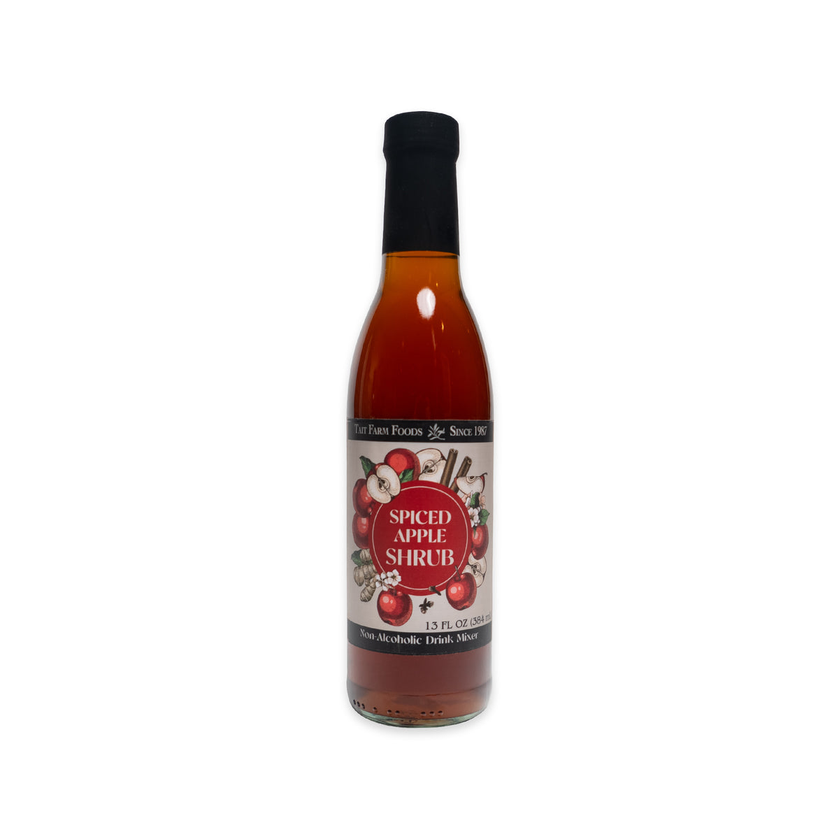 A glass bottle of amber-colored Spiced Apple Shrub, with a label featuring illustrations of apples and cinnamon sticks.
