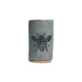Tiny Ceramic Tumbler, a small, handcrafted grey speckled ceramic cup featuring a black bee illustration.