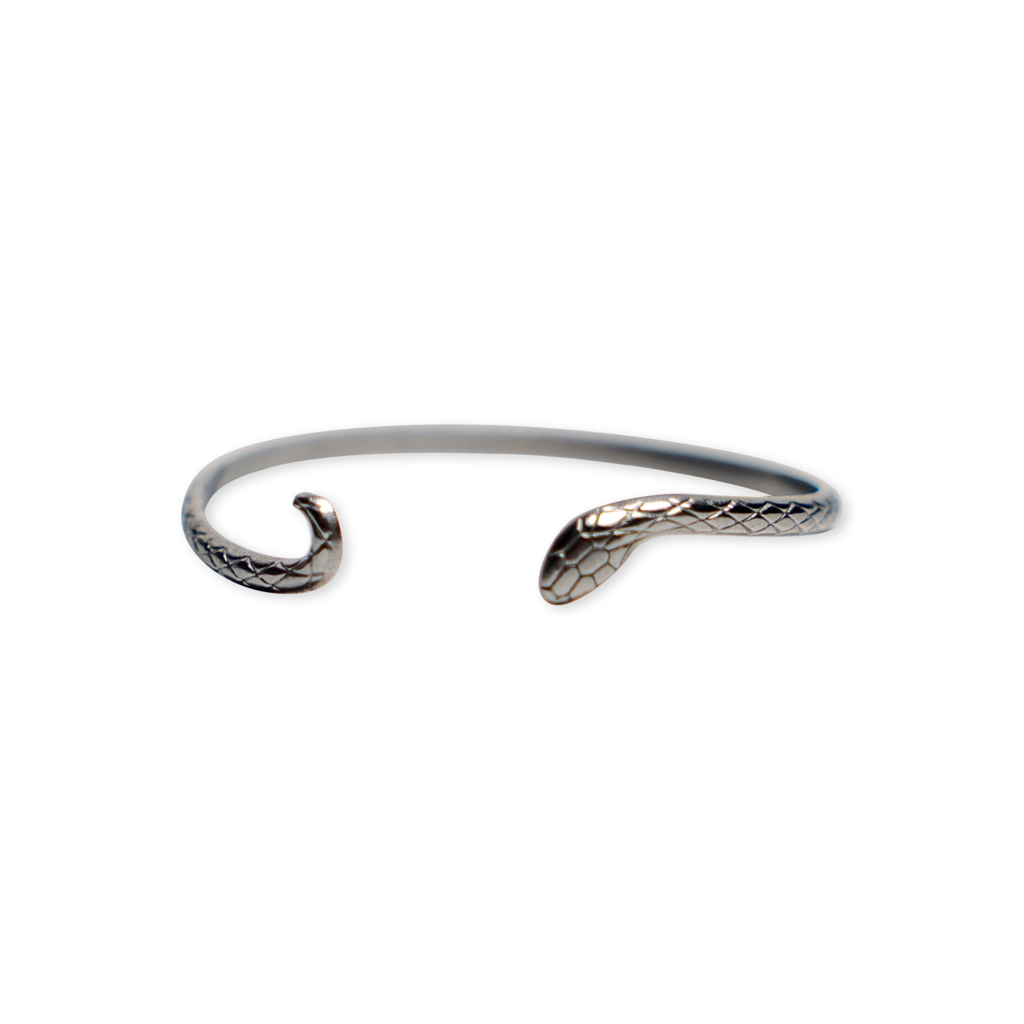 Introducing the Silver Snake Cuff Bracelet: an adjustable silver-plated piece with open ends sculpted into a snake’s head and tail, featuring finely engraved scale details for added elegance.