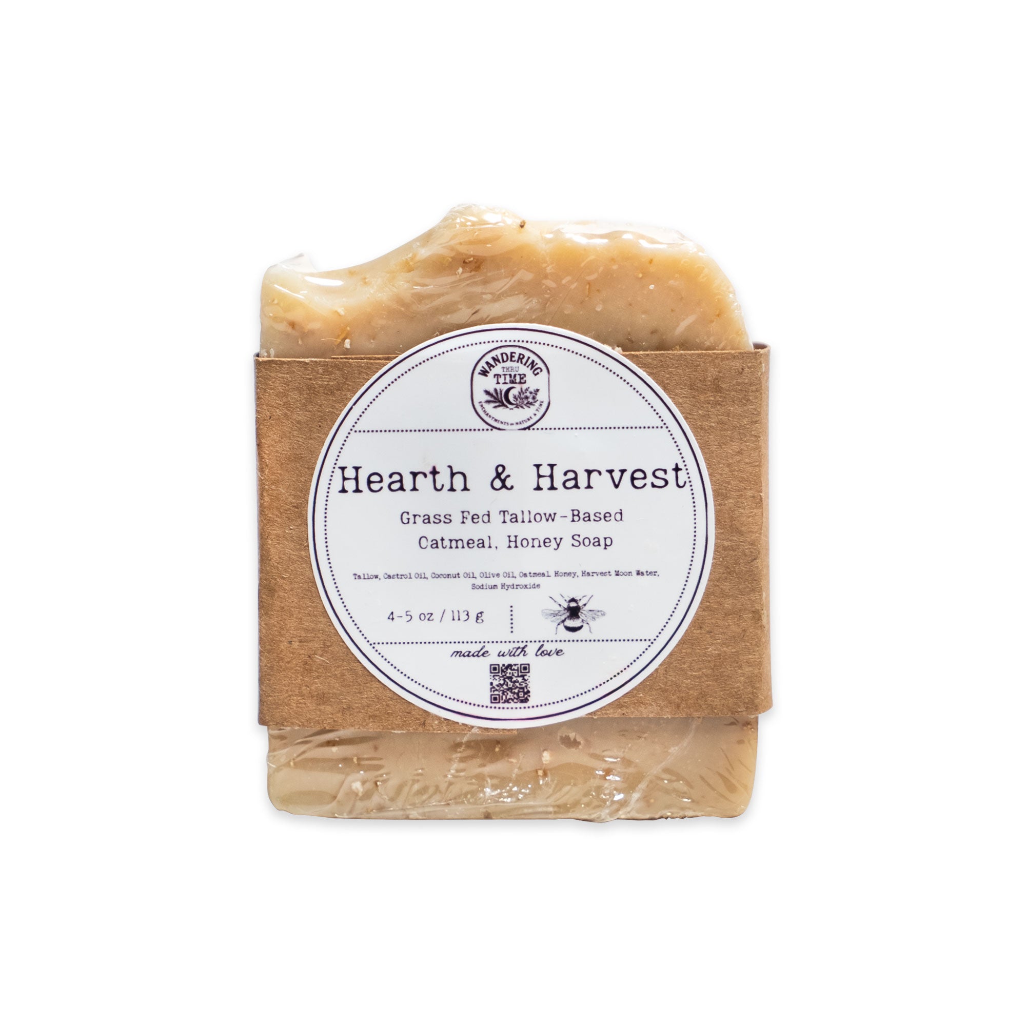 A bar of Hearth and Harvest Oatmeal Tallow Soap, ideal for natural skincare lovers, comes wrapped in brown paper with a white label featuring the brand name, product title, and ingredients. This handcrafted soap is partially visible through a transparent wrapper.