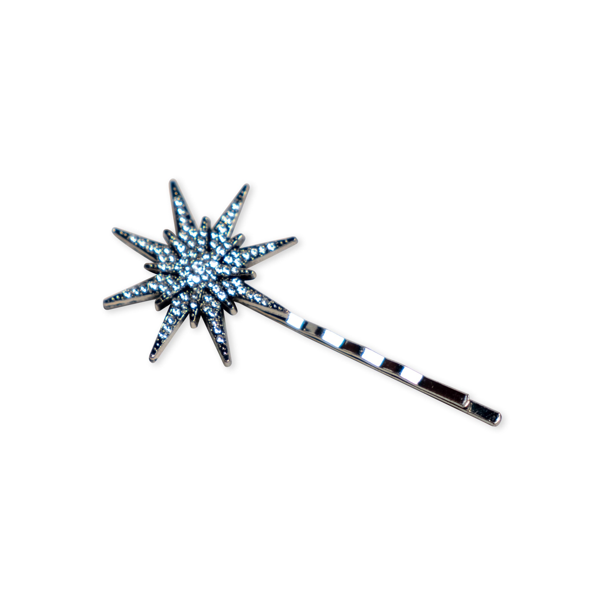 The Antiqued Star Barrette, an elegant silver hair accessory adorned with small rhinestones and designed in a starburst shape, rests on a white background—reminiscent of a vintage celestial hair clip.
