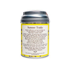 A silver tin labeled Summer Toddy, Spiced Bergamot rests against a white background, featuring a yellow floral design on its label. This non-alcoholic beverage includes brewing instructions and highlights an aromatic spice blend of black tea, spices, and lemon peel among its ingredients.