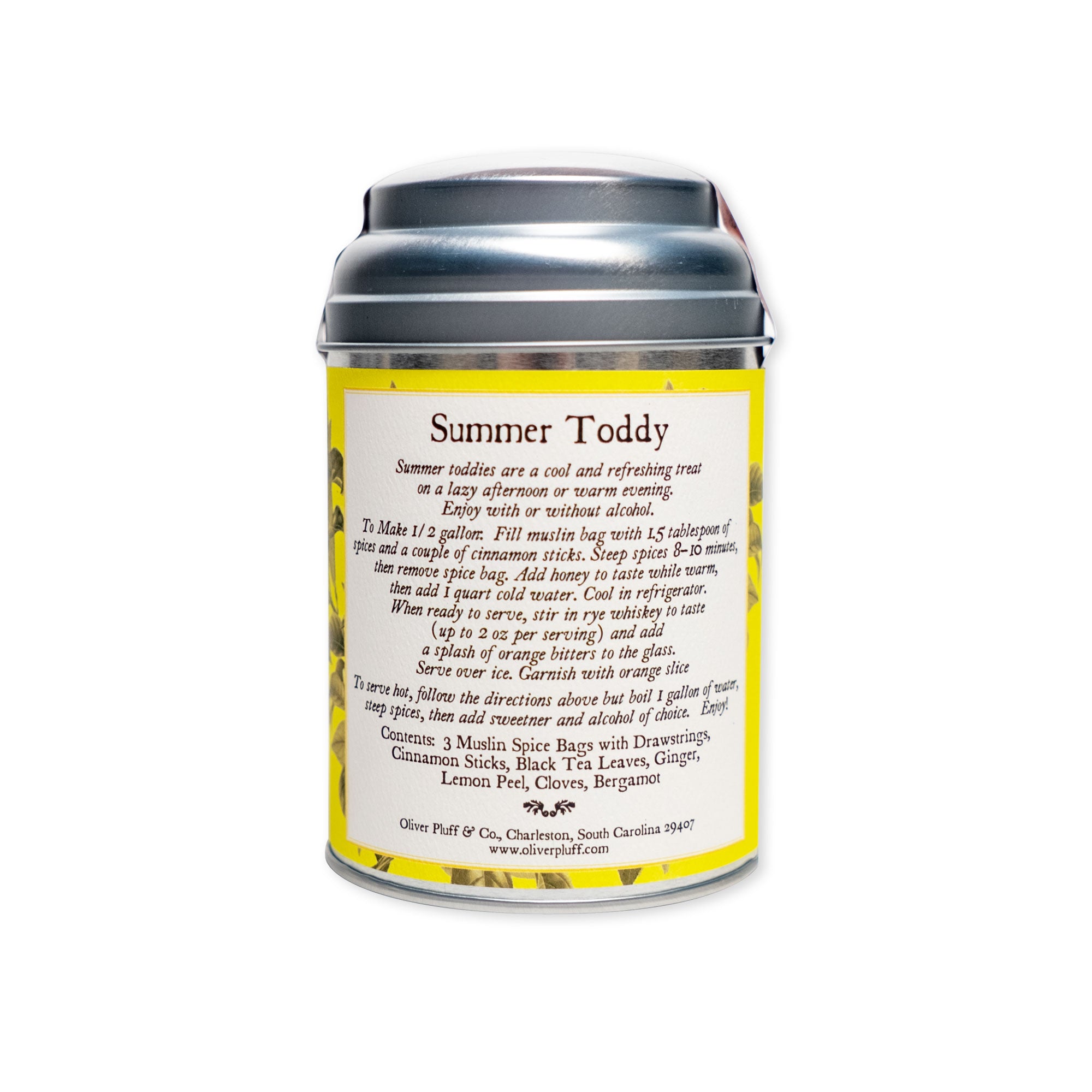 A silver tin labeled Summer Toddy, Spiced Bergamot rests against a white background, featuring a yellow floral design on its label. This non-alcoholic beverage includes brewing instructions and highlights an aromatic spice blend of black tea, spices, and lemon peel among its ingredients.
