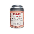 A cream and peach metal tin labeled "Summer Toddy, Spiced Hibiscus" by Oliver Pluff & Co. holds a 3 oz (85g) artisanal spice blend, featuring floral illustrations and cocktail recipe text—ideal for mixing a refreshing toddy or enhancing your favorite cocktails.