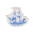 The Success to the Triphena Wood Magnet features a decorative blue-and-white illustration of the historic sailing ship Triphena with flags, shaped like a ship and crafted from wood, bearing the text “Success to the Triphene”—a charming tribute to American Revolutionary history.