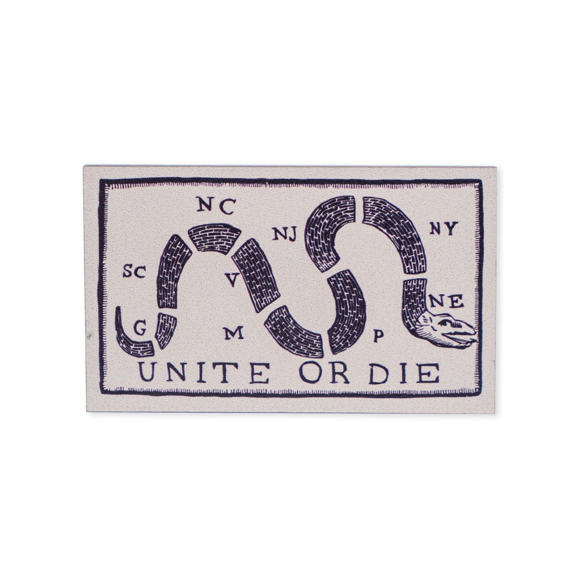 Bring a piece of American history into your home with the Unite or Die Wood Magnet. Featuring a segmented snake adorned with state abbreviations like SC, NC, and VA above the bold phrase "UNITE OR DIE" in vintage style, this natural wood magnet adds patriotic charm and striking historical appeal to any space.