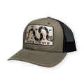 The Unite or Die Trucker Hat features a khaki and black design with a patch depicting a segmented snake and the phrase “UNITE OR DIE,” inspired by Benjamin Franklin’s iconic historical flag that pays tribute to American heritage.