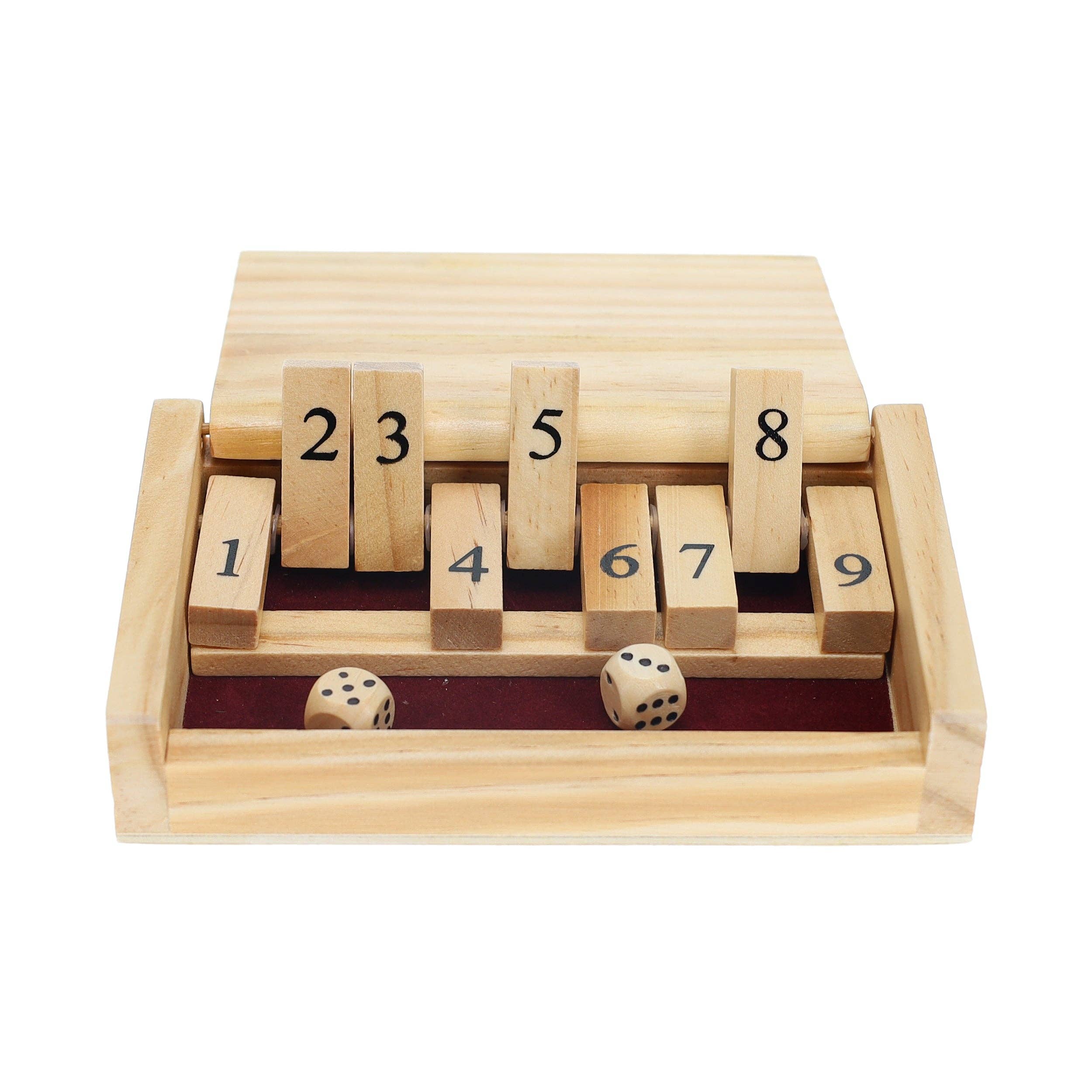 The Mini 9 Number Shut The Box Game features tiles numbered 1 to 9, with numbers 1, 4, 6, 7, and 9 flipped down and two dice showing a roll of 2 and 5—all set in a wooden tray lined with red felt. This compact game is the perfect travel-sized dice game for hours of fun wherever you go.