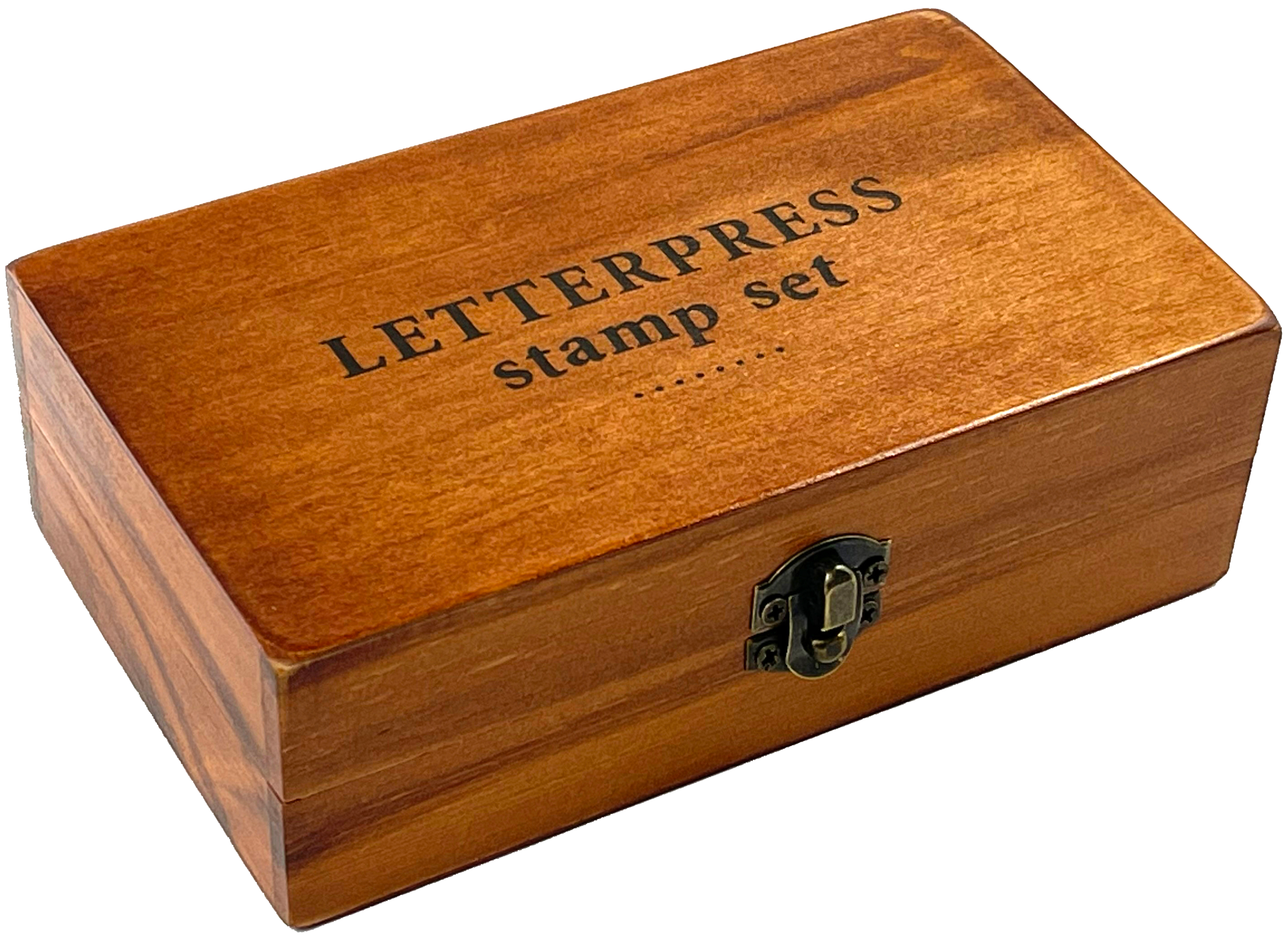 The Letterpress Stamp Set comes in a rectangular wooden box with a black-lettered lid and latch, containing rubber-tipped wooden stamps ideal for creative projects.