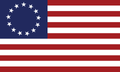 The Betsy Ross Flag Sticker showcases 13 red and white stripes and a blue canton with 13 stars in a circle.