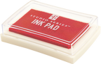 A rectangular red ink pad from the Studio Series Ink Pad Set, featuring a clear plastic lid and white base — perfect for scrapbooking — displayed on a plain background.