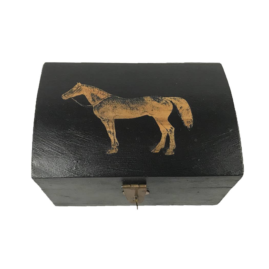 The Standing Horse Antiqued Storage Box is a black wood box with a curved lid, adorned with a golden horse silhouette and a small metal latch.