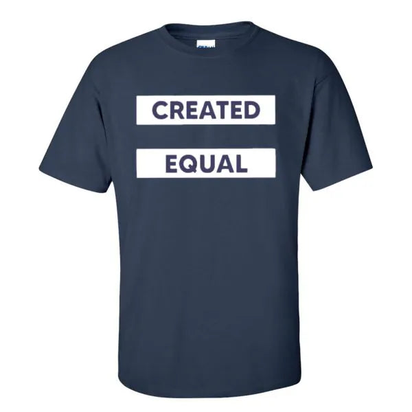 The Created Equal T-Shirt, Blue, features bold white text in two boxes — CREATED on top and EQUAL below — inspired by the Declaration of Independence.