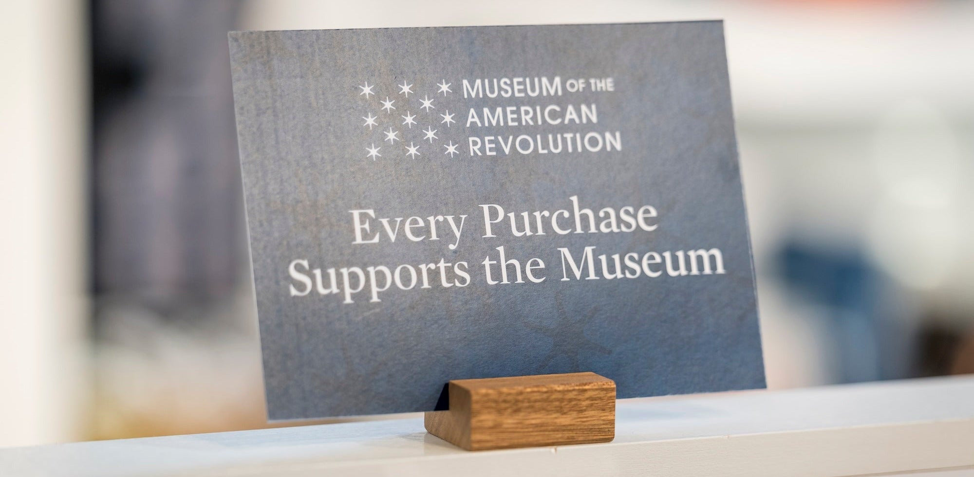 Sign at Museum of the American Revolution indicating support for the museum through purchases.