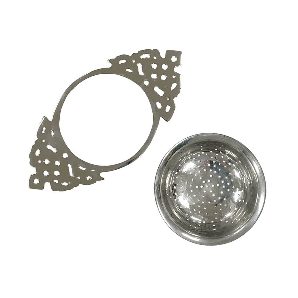 The Nickel Plated Tea Strainer, featuring a vintage-style lacy handle and matching round perforated sieve cup, is elegantly displayed on a white background — ideal for enjoying loose-leaf tea.